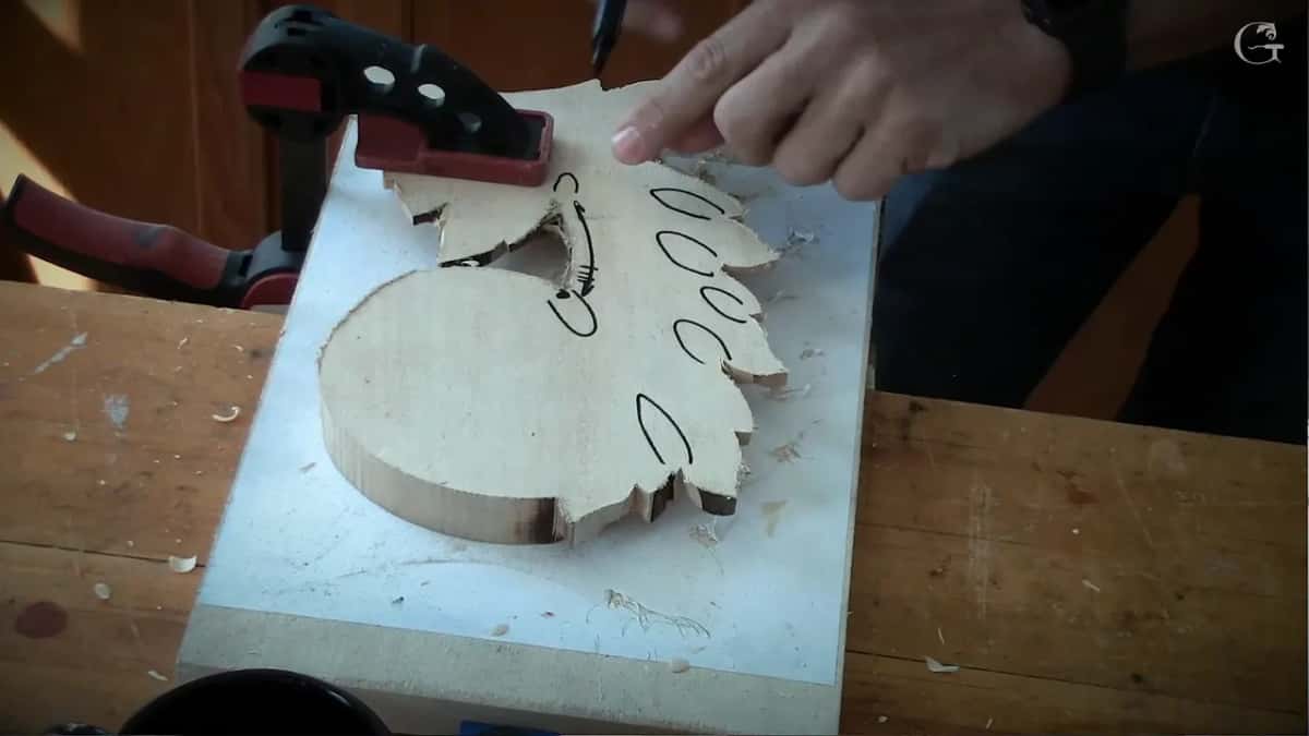 Clamped, and the marks now on it, with a few chips already on the bench beside