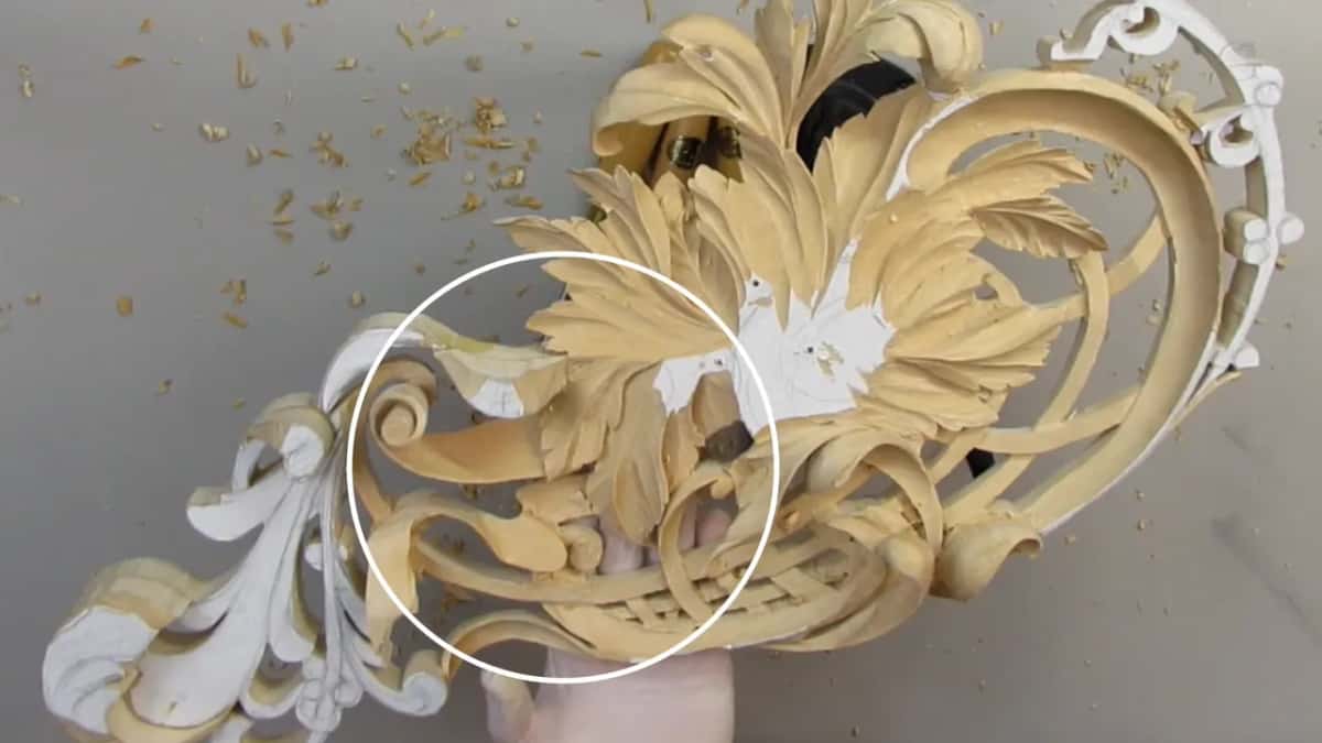 White circle drawn on screen around the spot where my gloved hand holds the wood from behind