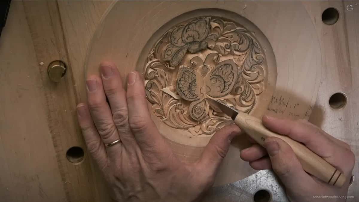 Pencil notes on the rim, and a knife working inside the lower butterfly