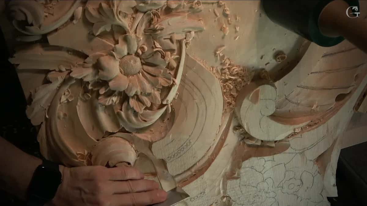 Wide flat steel against the band, chips heaped by the scroll