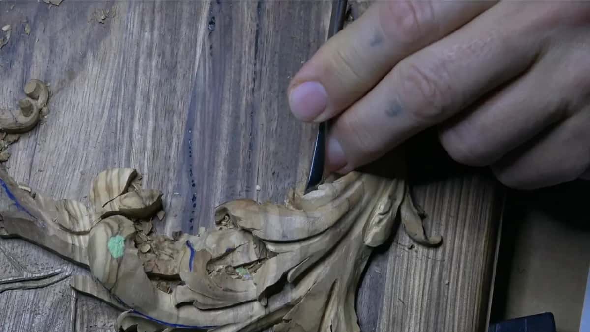 Gouge held nearly upright at the rim