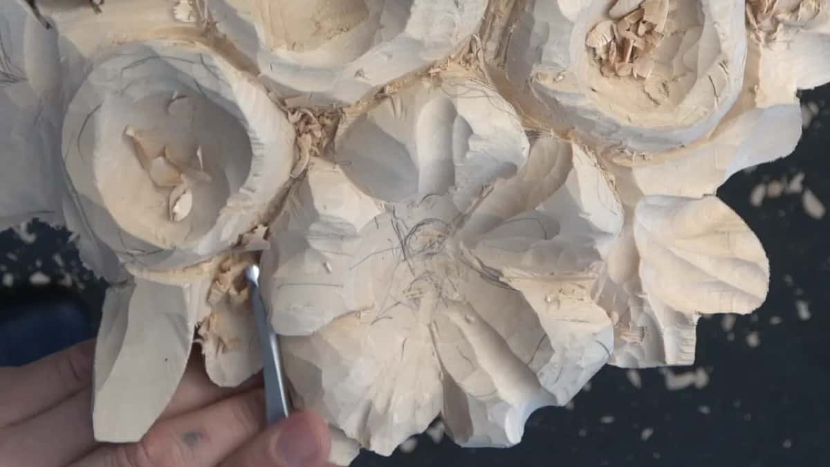 Every facet the gouge left standing on a finished petal, catching light along its length
