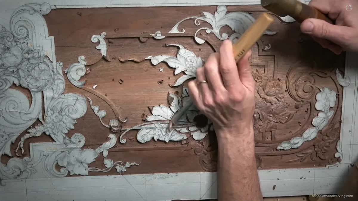 Whole board seen overhead, one gouge in hand.