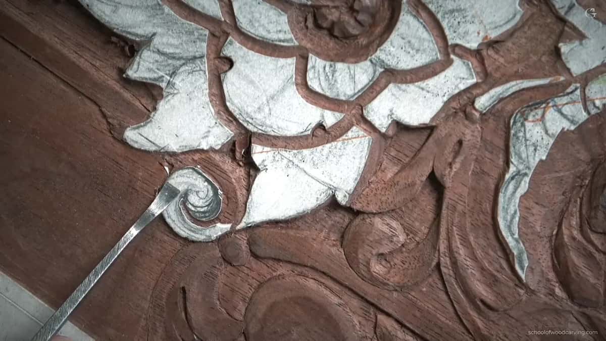 Close on the eye of the scroll, where the whole shape has to be made in almost no wood.