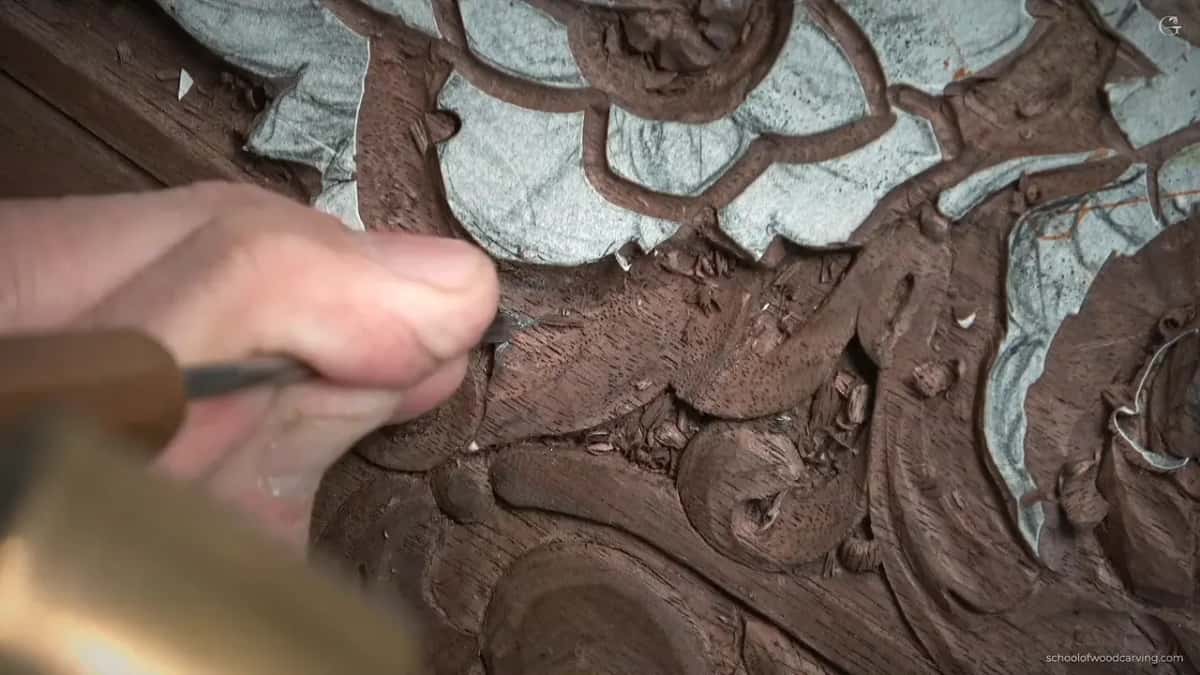 Pale handle in his fist, the edge coming straight down.