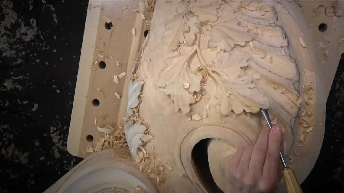 Whole piece on a drilled bench, a gouge at the shell's edge.