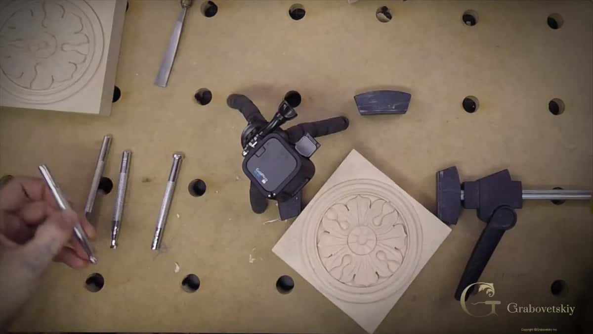 Turning the piece on the bench to bring the next section round