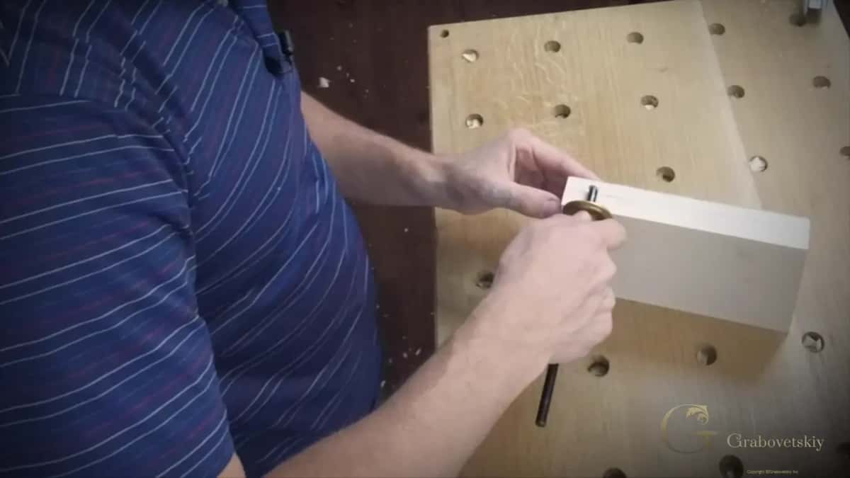 Marking the depth line round the edge of the block with a pencil
