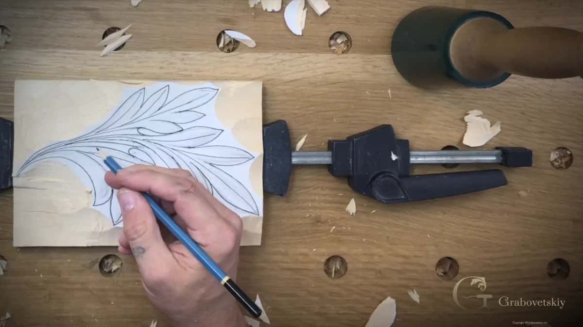 Pencil on the drawing, checking a line before anything is cut into it for good