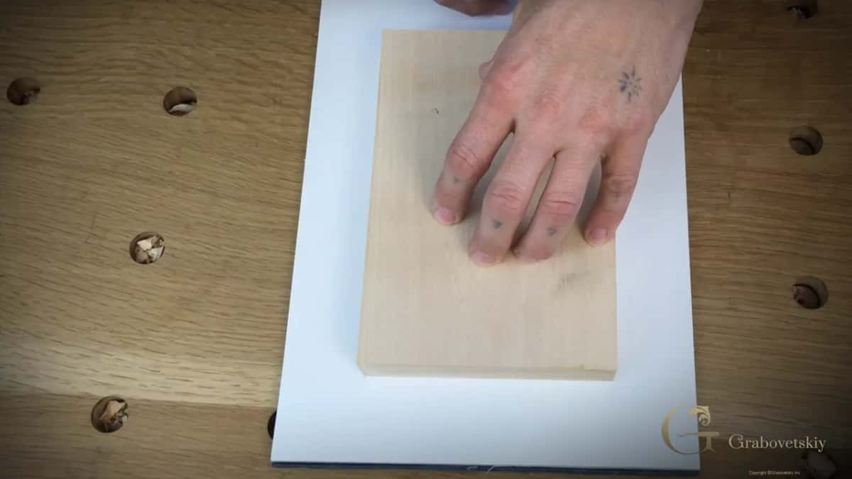 The blank block laid on a sheet of paper, ready to be drawn round in a moment