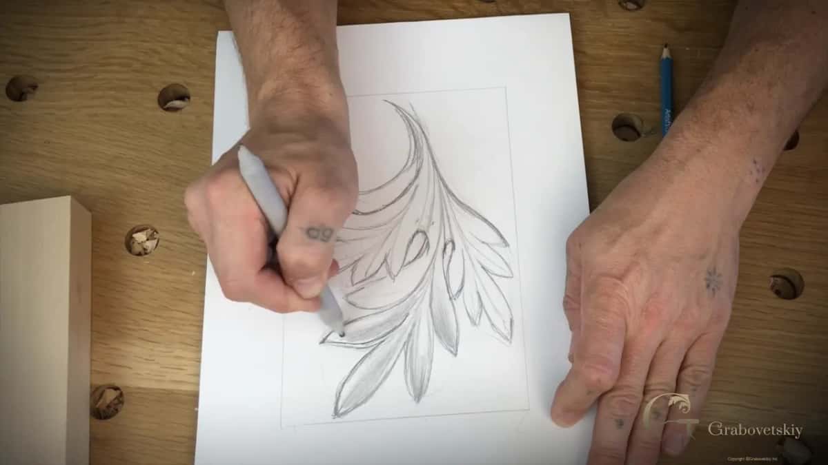 Shading laid into the hollows so the incut reads before any tool touches the wood