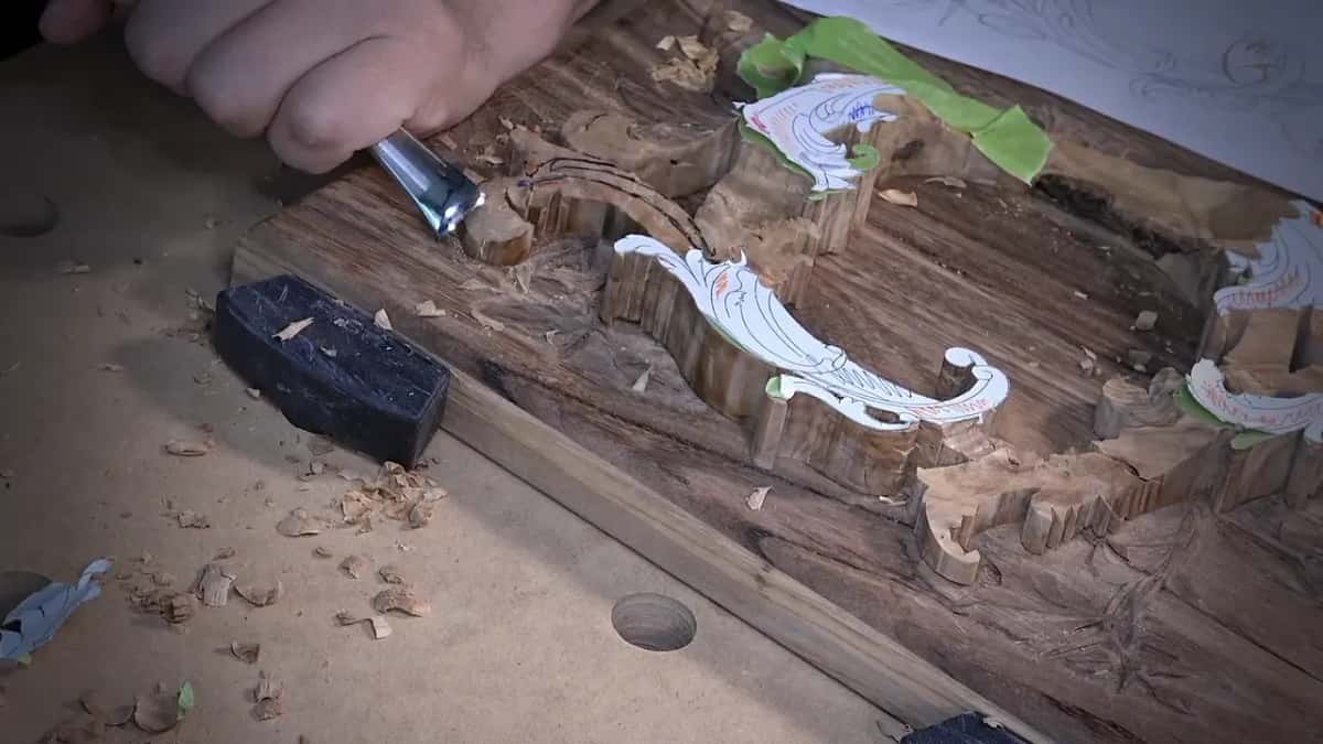 Gouge at the near scroll, green tape at the back