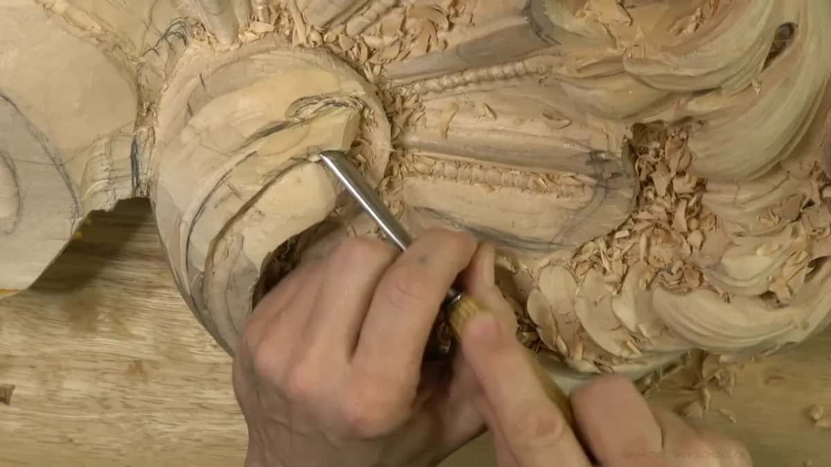 Gouge digging deep into the hollow of the scroll.