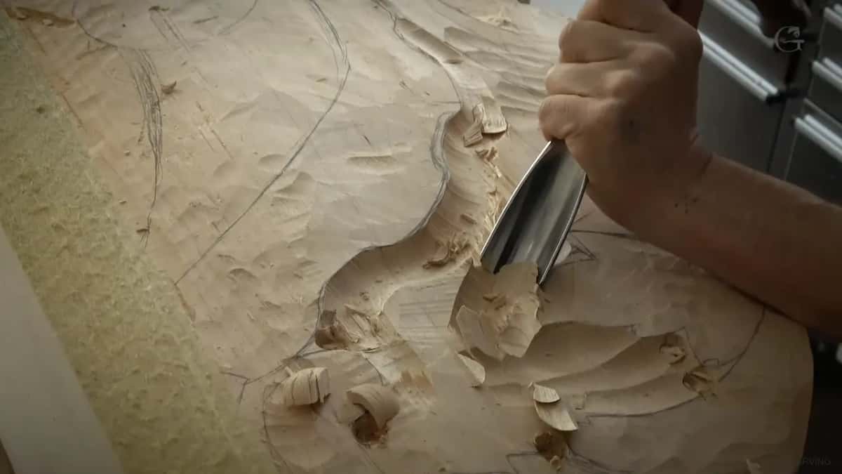 Close view of a big gouge pushing through the wood.