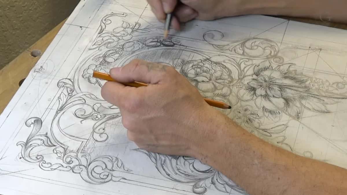 One pencil points at the detail to be hidden while the other enlarges the flower that will cover it