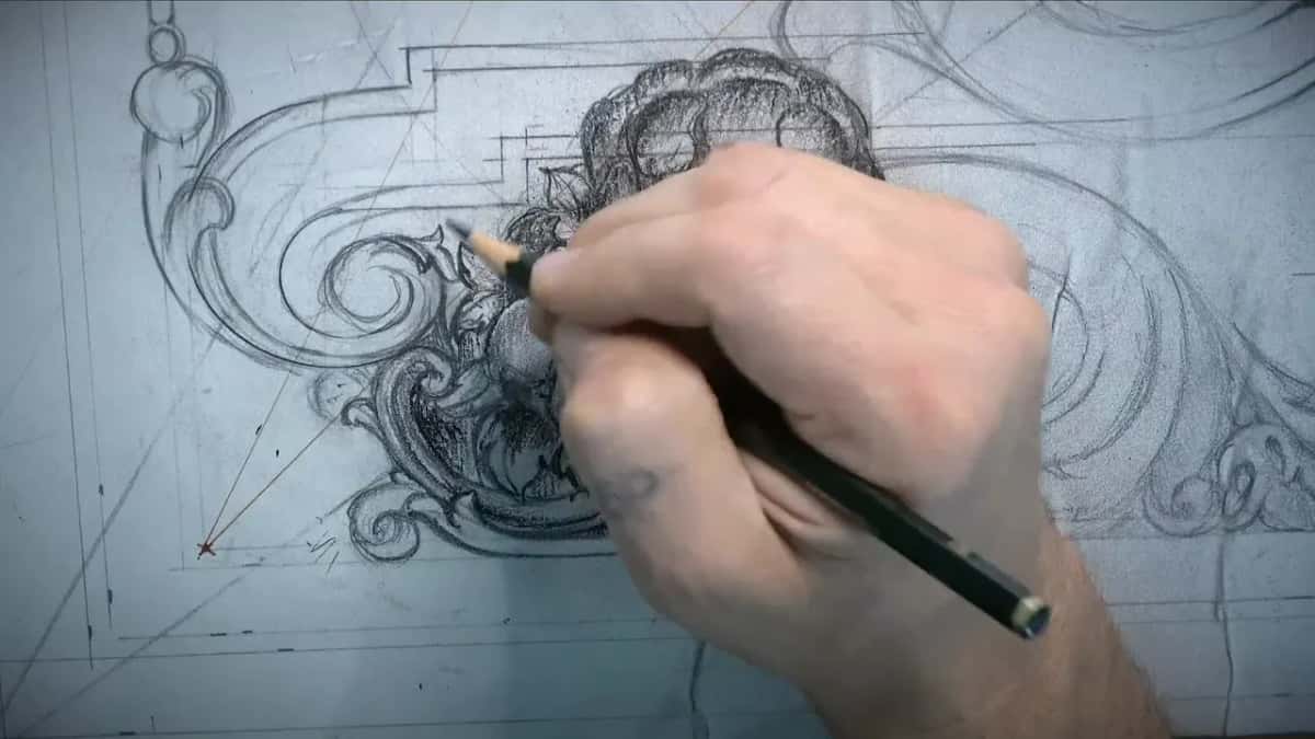 Small acanthus drawn wrapping around the outside of a volute