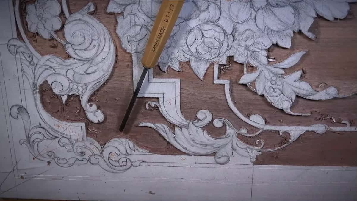 A tool laid down on the board, maker's stamp showing along the shank