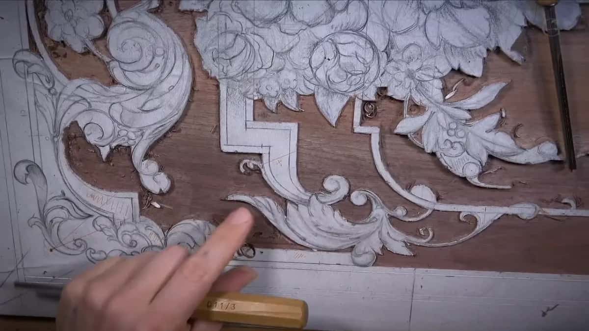 A finger on the step where one level drops to the next