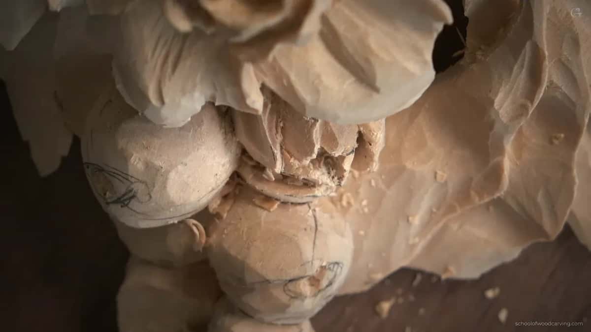 Macro of carved petals and buds with pencil lines still showing on them and a dark gap opening at the top