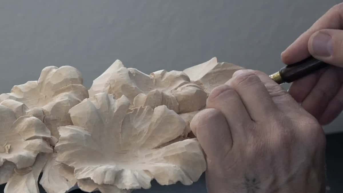 A small knife doing an outline no gouge could reach.