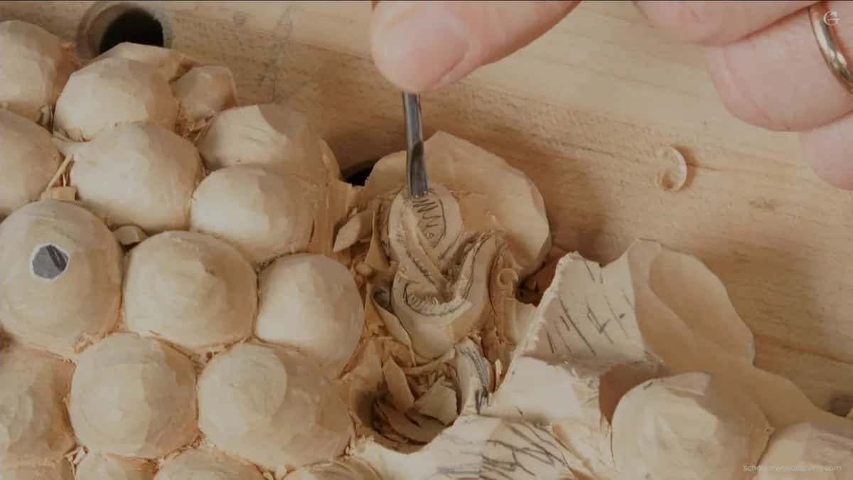One of the miniature gouges going into a gap a full size tool cannot enter