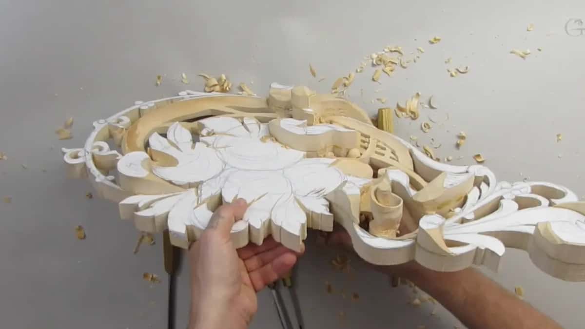Both hands turning the work