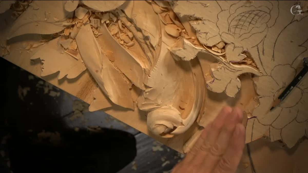 Overhead of the board with one half carved and the other still only drawn in pencil