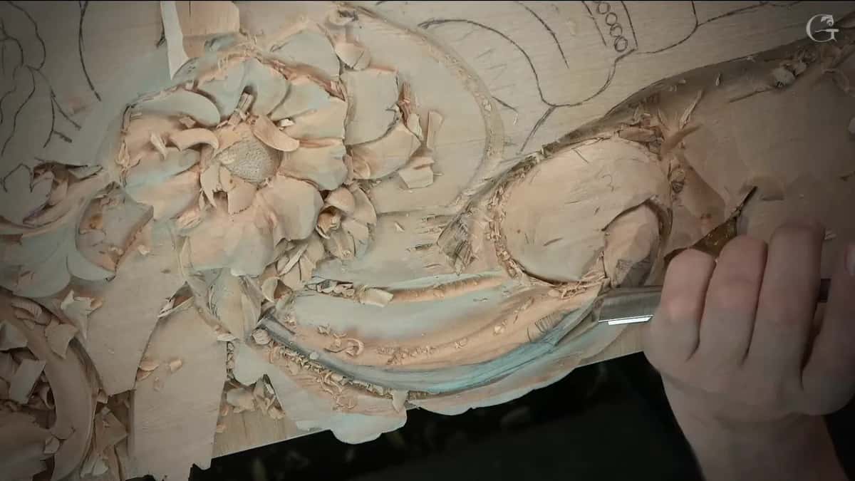 Rolling the acanthus scroll edge over