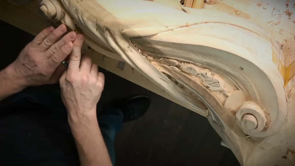 Down the long side Working a small tool along the long curved side of the corbel