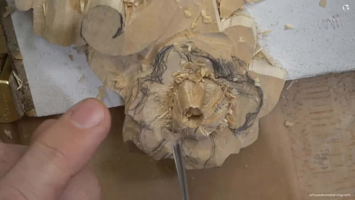 Tool stood upright in the middle of the rosette, right where the grain gave way under pressure.