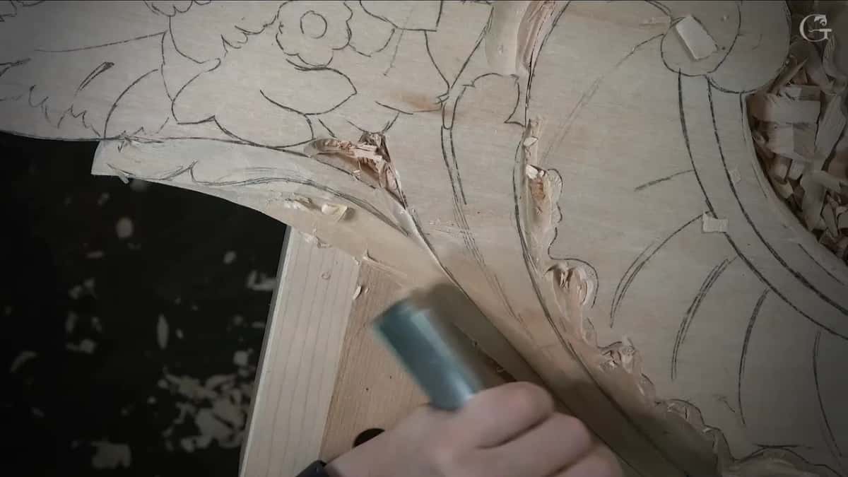 Veiner working at the exact turn where one pass must join another, pencil design still drawn all around it