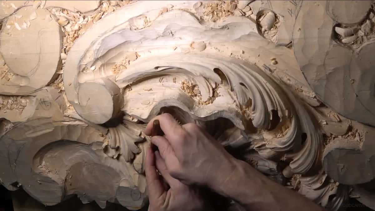 Deep in the center, two hands reach in at an angle.