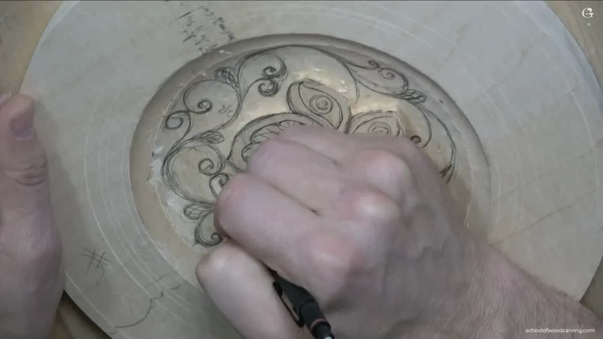 Right hand over the left half of the dish, where curls reach the rim