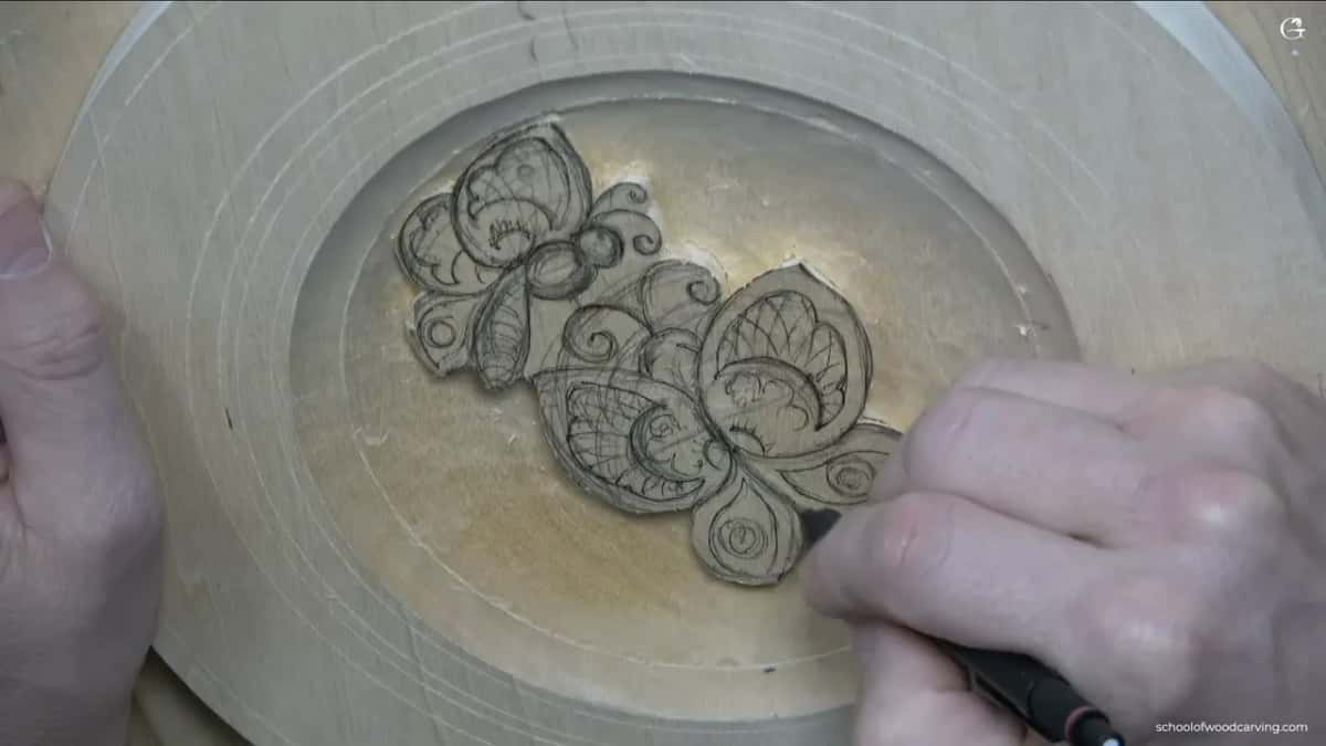 First lines go in beside the lower wing while the left hand holds the plate steady