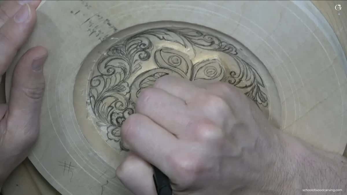 Knuckles cover the lower dish while the pencil works the ground between the butterflies and the rim