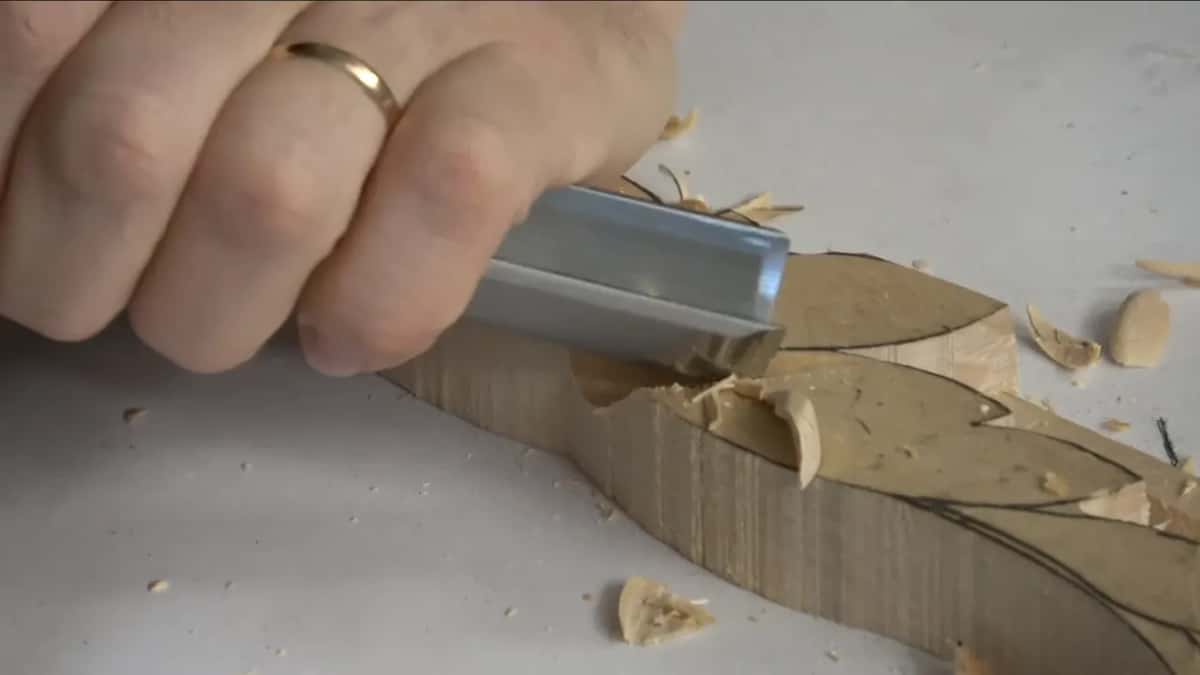Wide chisel in a fist.