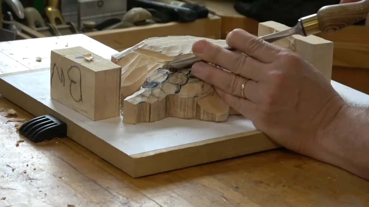 Slicing round a bloom, shavings piling on the board