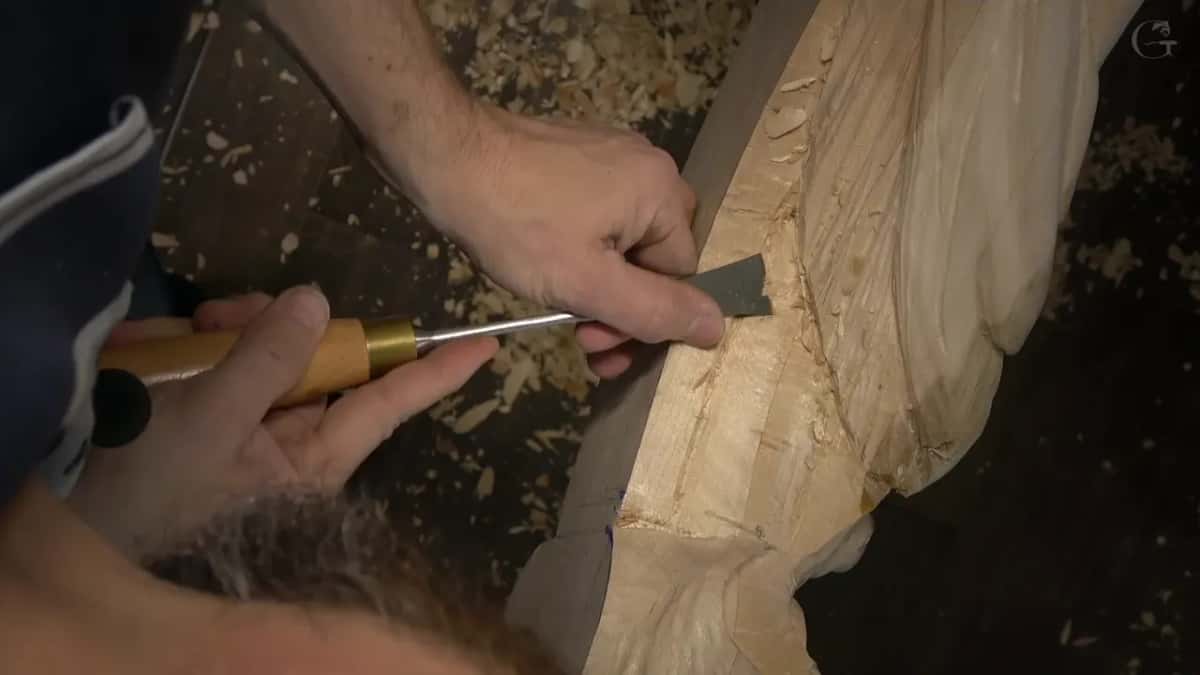 Both hands on one gouge.