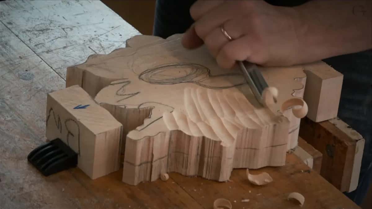 Wide sweep of gouge facets across the blank