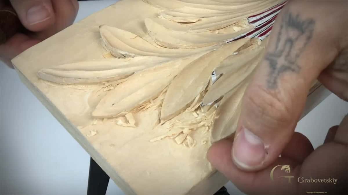 Tilted in the hand, deeply undercut.