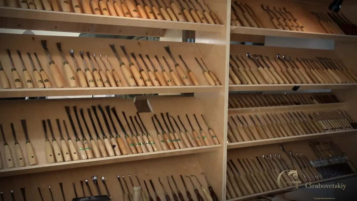 Rows and rows of gouges standing in the wall rack behind the bench.