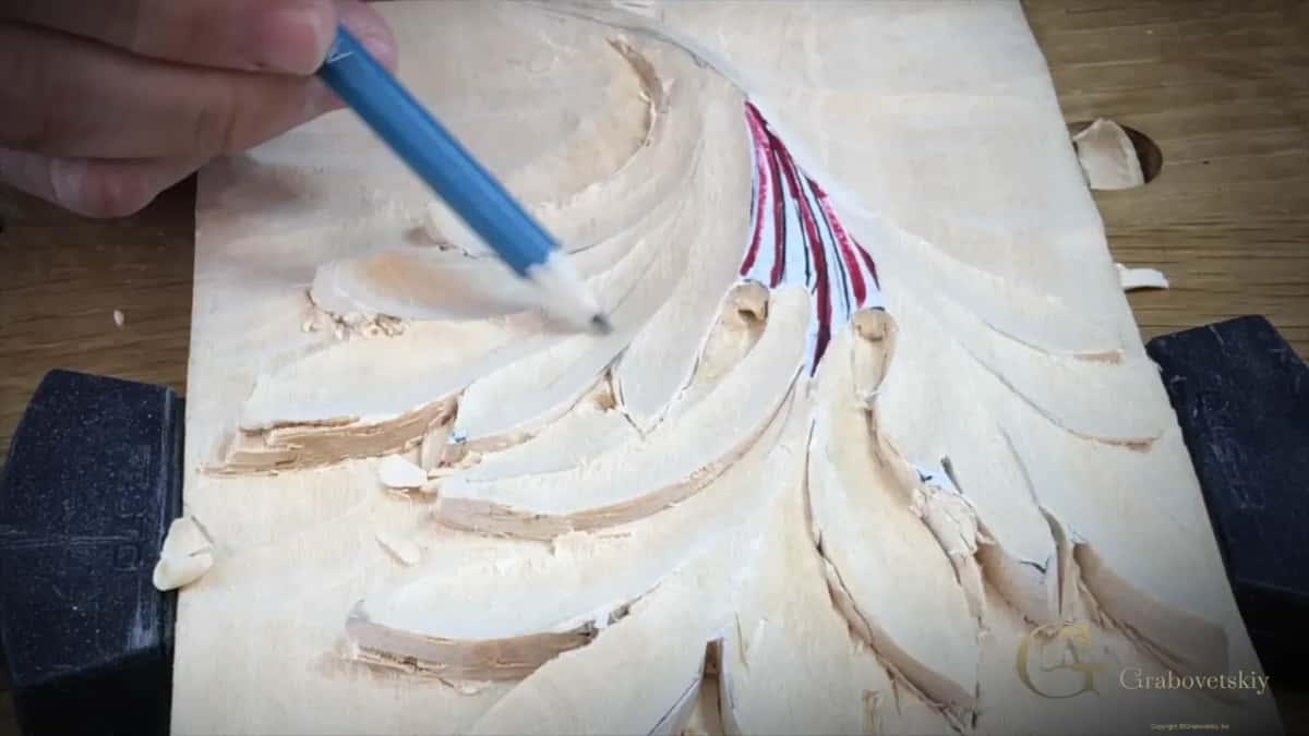Blue pencil tip resting in a hollow.