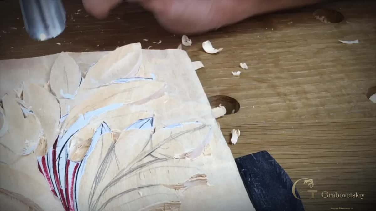 Overhead view of the whole panel, red and blue lines on the leaf, shavings all round the clamps.