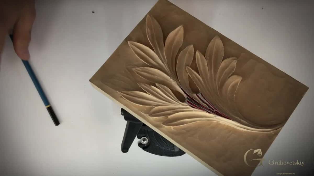 On its stand, pencil alongside.