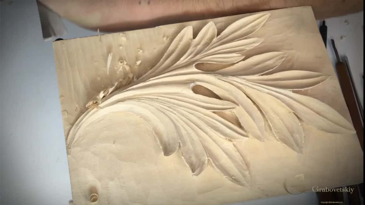 Forearm across the bench, the ground being sliced flat.