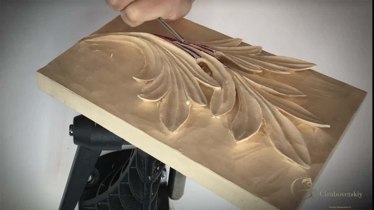 Fine blade entering the eye while the board tilts away.