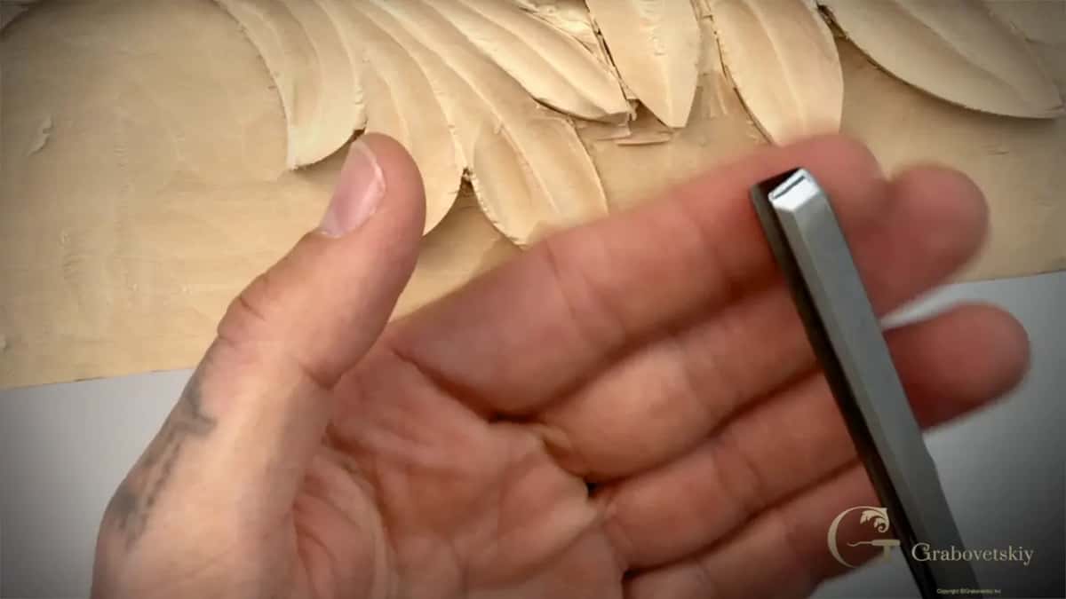 An open palm and a V tool.