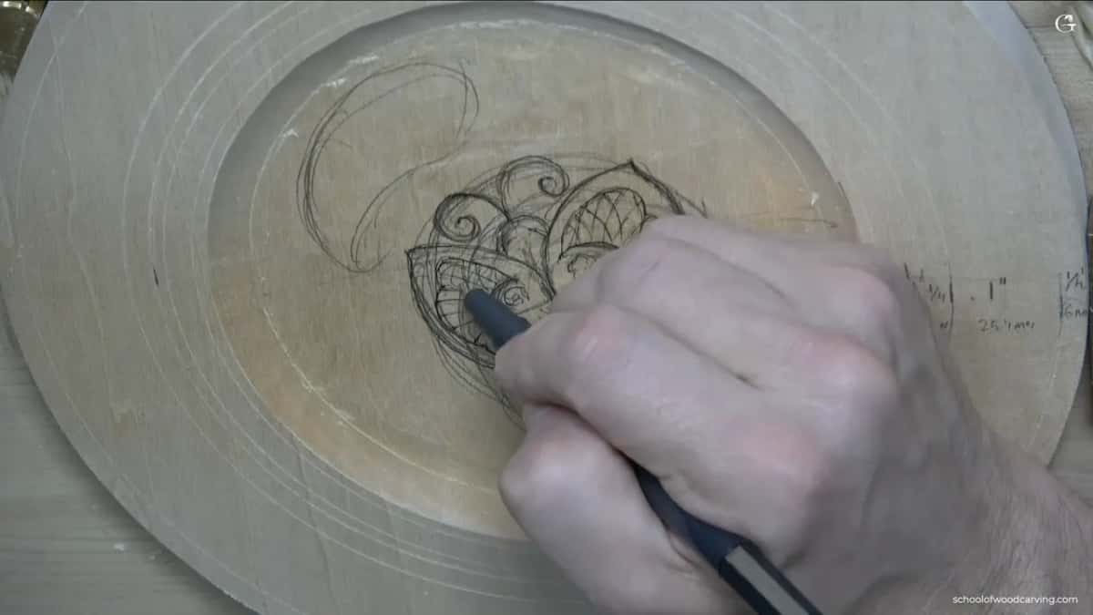 Pen in hand, he runs a fan of lines across the lower wing, all of them leaning toward the same spot.