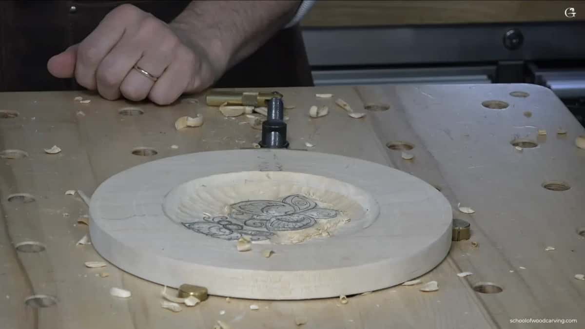 The plate on the bench, its pair of butterflies standing in the lowered dish.