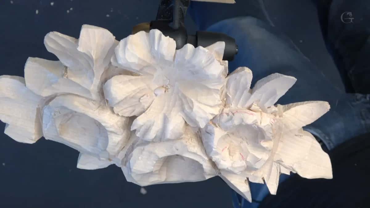 Whole second layer held up, one flower shaped and the next still rough